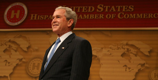 President George W. Bush smiles as he's introduced Wednesday, March 12, 2008, onstage at the Ronald Reagan Building and International Trade Center where he spoke to the United States' Hispanic Chamber of Commerce. The USHCC is the most influential Hispanic business organization in the United States, communicating the needs of Hispanic enterprise to corporate America and the Federal government. White House photo by Joyce N. Boghosian