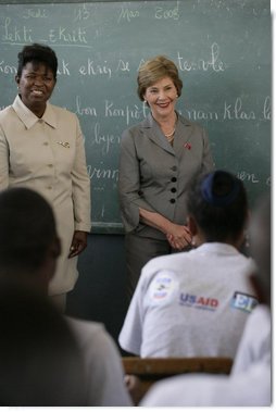 Mrs. Laura Bush visits students enrolled in the IDEJEN educational program at the College de St. Martin Tours Thursday, March 13, 2008, in Port-au-Prince, Haiti. Speaking to the program’s faculty and staff Mrs. Bush said, “Educating its young people is one of the best things a country can do to ensure its continued development.” White House photo by Shealah Craighead
