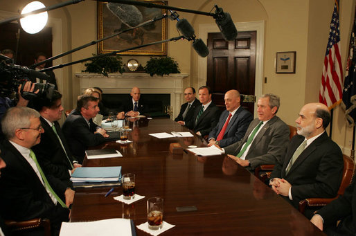 President George W. Bush is flanked by Ben Bernanke, Chairman of the Federal Reserve, and Hank Paulson, Secretary of the Treasury, during a meeting at the White House Monday, March 17, 2008, with the President's Working Group on Financial Markets. White House photo by Joyce N. Boghosian
