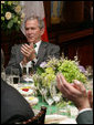 President George W. Bush applauds the music entertainment at the Speaker of the House's annual St. Patrick's Day luncheon Monday, March 17, 2008 at the U.S. Capitol in Washington, D.C. White House photo by Chris Greenberg