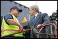 President George W. Bush shakes hands with Frederick Bishop, a stacker operator for Coastal Maritime Stevedoring, LLC, during a tour Tuesday, March 18, 2008, of the Blount Island Marine Terminal in Jacksonville, Fla. The President toured the facility while in the state to deliver remarks on trade policy. White House photo by Chris Greenberg