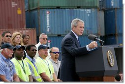 President George W. Bush, joined on stage by port workers, delivers remarks on U.S. trade policy Tuesday, March 18, 2008, at the Blount Island Marine Terminal in Jacksonville, Fla. White House photo by Chris Greenberg