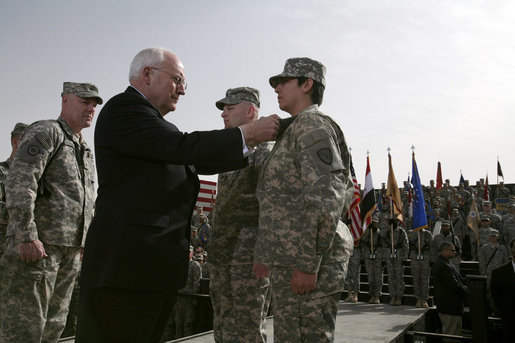 Vice President Dick Cheney awards PFC Veronica Alfaro with the Bronze Star Tuesday, March 18, 2008, during a rally for U.S. troops at Balad Air Base, Iraq. "I can't describe the feeling I had when he awarded me the Bronze Star," said Alfaro, 2nd Platoon senior medic, Bravo Company. "It is definitely a moment I will always remember and cherish; I will never forget it." White House photo by David Bohrer
