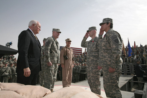 Staff Sgt. Shane Lindsey, second right, and PFC Veronica Alfaro, far right, salute Vice President Dick Cheney after being awarded the Bronze Star Tuesday, March 18, 2008, during a rally for U.S. troops at Balad Air Base, Iraq. White House photo by David Bohrer