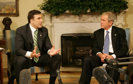 President George W. Bush listens as Mikhail Saakashvili offers remarks as they meet Wednesday, March 19, 2008, in the Oval Office of the White House. President Saakashvili expressed his gratitude for America's support, saying, "I have to thank you, Mr. President, for your unwavering support for our freedom, for our democracy, for our territorial sovereignty, and for protecting Georgia's borders, and for Georgia's NATO aspiration." White House photo by Joyce N. Boghosian
