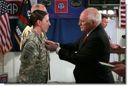 Vice President Dick Cheney awards the Silver Star Medal to Army Specialist Monica Brown of Lake Jackson, Texas Thursday, March 20, 2008, following a dinner with U.S. troops at Bagram Air Base, Afghanistan. While serving as a combat medic in April of 2007, Spc. Brown, 19, showed extraordinary heroism when she used her body to shield wounded soldiers from enemy gunfire and mortar shelling, then moving them to safety after their convoy came under attack in Afghanistan’s eastern Paktia province. She is the second woman since World War II to receive the Silver Star. White House photo by David Bohrer