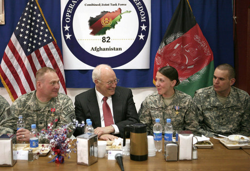Vice President Dick Cheney shares a light moment with 19-year-old Silver Star Medal recipient U.S. Army Specialist Monica Brown, center right, during a dinner with U.S. troops Thursday, March 20, 2008 at Bagram Air Base, Afghanistan. Joining the Vice President and Spc. Brown are from left: TSgt. Vernon Jones; Army Commendation Medal for Valor recipient Spc. Charles Bell; and Spc. Brown's brother, infantryman Justin Brown. White House photo by David Bohrer