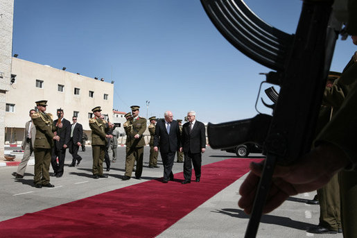 Vice President Dick Cheney and President Mahmoud Abbas of the Palestinian Authority walk through an honor cordon after the arrival Sunday, March 23, 2008, of the vice president to the West Bank city of Ramallah. White House photo by David Bohrer