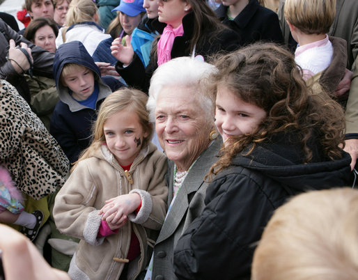 Former first lady Barbara Bush is surrounded by children as she poses for photos Monday, March 24, 2008, following her reading at the 2008 White House Easter Egg Roll, where she read "Arthur's New Puppy." White House photo by Chris Greenberg