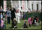 President George W. Bush, joined by Mrs. Laura Bush, blows a whistle Monday, March 24, 2008 on the South Lawn of the White House, to officially start the festivities for the 2008 White House Easter Egg Roll. White House photo by Shealah Craighead