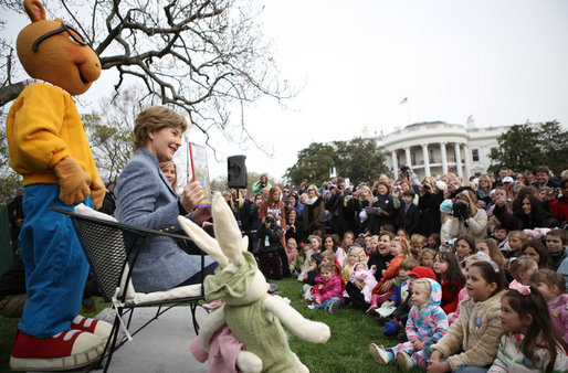 Mrs. Laura Bush, joined by her daughter, Jenna, and the PBS character "Arthur," reads the book "Arthur Meets the President," Monday, March 24, 2008, during festivities at the 2008 White House Easter Egg Roll on the South Lawn of the White House. White House photo by Shealah Craighead