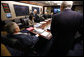 President George W. Bush is seen at a National Security Council meeting in the White House Situation Room Monday, March 24, 2008, during a video teleconference with General David Petraeus, Commander of the Multi-National Force-Iraq; and Ryan Crocker, U.S. Ambassador to Iraq. White House photo by Eric Draper