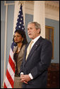 President George W. Bush stands with U.S. Secretary of State Condoleezza Rice as he talks with reporters Monday, March 24, 2008, following a briefing at the U.S. Department of State in Washington, D.C. White House photo by Eric Draper