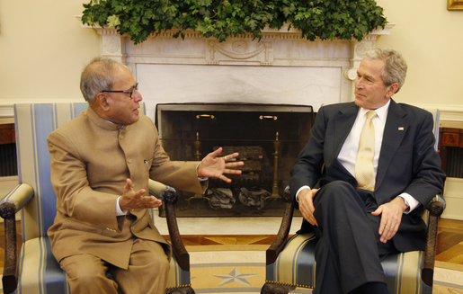 President George W. Bush welcomes India's Minister of External Affairs Pranab Kumar Mukherjee to a meeting in the Oval Office Monday, March 24, 2008, at the White House. White House photo by Eric Draper