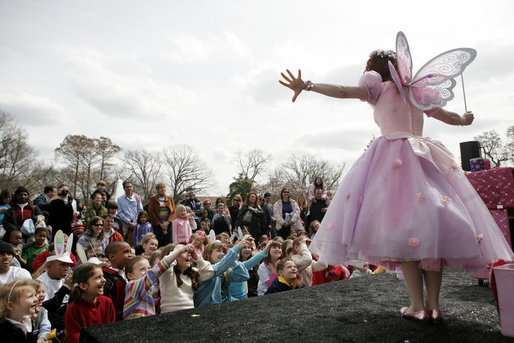 Children gather at the Magic Stage on the South Lawn of the White House to watch magician Fairy Twinkletoes perform Monday, March 24, 2008, during the 2008 White House Easter Egg Roll. White House photo by Grant Miller