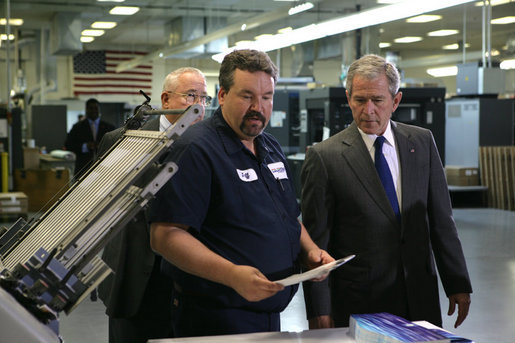 President George W. Bush talks with employees during his visit to ColorCraft of Virginia, Inc. Wednesday, March 26, 2008, in Sterling, Virginia. White House photo by Chris Greenberg