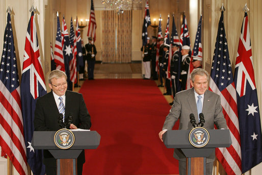 President George W. Bush and Australian Prime Minister Kevin Rudd react to a question during their joint press availability in the East Room of the White House Friday, March 28, 2008. White House photo by Joyce N. Boghosian