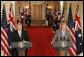 President George W. Bush and Australian Prime Minister Kevin Rudd react to a question during their joint press availability in the East Room of the White House Friday, March 28, 2008. White House photo by Joyce N. Boghosian
