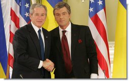 President George W. Bush and President Viktor Yushchenko of the Ukraine shake hands after their joint press availability Tuesday, April 1, 2008, at the Presidential Secretariat in Kyiv. President and Mrs. Laura Bush attended daylong events in the Ukraine capital before departing for Romania, site of the 2008 NATO Summit. White House photo by Chris Greenberg