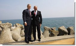 President George W. Bush and President Traian Basescu of Romania, pose for photographs Wednesday, April 2, 2008, on a seawall at the presidential retreat in Neptun, Romania. President Bush spent the day with his Romanian counterpart before the opening of the 2008 NATO Summit. White House photo by Eric Draper