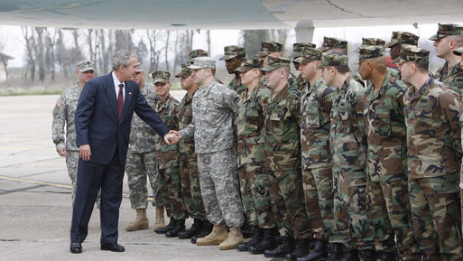President George W. Bush reaches out to U.S. military personnel Wednesday, April 2, 2008, as he arrived at Mihail Kogalniceanu Airport in Constanta, Romania, for his return flight to Bucharest after meeting with President Traian Basescu at his presidential retreat in Neptun. White House photo by Eric Draper