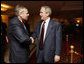 President George W. Bush greets NATO Secretary General Jaap de Hoop Scheffer Wednesday, April 2, 2008, at the JW Marriott Bucharest Grand Hotel in Bucharest, site of the 2008 NATO Summit. White House photo by Eric Draper