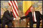 President George W. Bush and President Traian Basescu of Romania, exchange handshakes during their meeting Wednesday, April 2, 2008, in Neptun, Romania. White House photo by Eric Draper