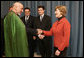 Mrs. Laura Bush greets Afghanistan President Hamid Karzai at the Headquarters of the Romanian Intelligence Service Thursday, April 3, 2008, where they participated in the Young Atlanticist Summit Video Conference with Kabul University. White House photo by Shealah Craighead