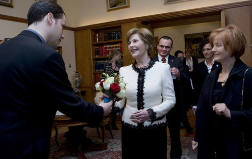 Mrs. Laura Bush accepts a bouquet of flowers as she arrives for tea Friday, April 4, 2008, with Mrs. Milka Mesic, right, spouse of Croatian President Stjepan Mesic, at the Office of the President in Zagreb. White House photo by Shealah Craighead