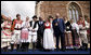 President George W. Bush and Prime Minister Ivo Sanader appear on stage with dancers in traditional Croatian garb Saturday, April 5, 2008, in Zagreb's St. Mark's Square. The President and Mrs. Bush made the overnight stop in the Croatian capitol before departing for Russia. White House photo by Eric Draper