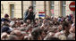 A young girl, atop the shoulders of a friend to get a better view, applauds in the crowd at Zagreb's St. Mark's Square as President George W. Bush addresses the thousands who turned out to welcome him Saturday April 5, 2008. White House photo by Shealah Craighead