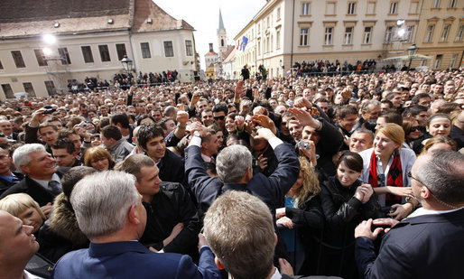President George W. Bush reaches out to the crowd Saturday during his visit to St. Mark's Square in Zagreb. More than 3,000 people were on hand to welcome the President during his visit. White House photo by Eric Draper