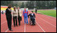 Mrs. Laura Bush walks on the track of Central Sochi Stadium Sunday, April 6, 2008, with Mr. Mikhail Terentyev, Secretary General of the Russian Paralympic Committee, Ms. Lisa Carty, spouse of the U.S. Ambassador to Russia William Burns, and Mrs. Irina Gromova, Coach of the Russian Paralympic team. White House photo by Shealah Craighead