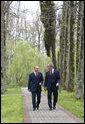 President George W. Bush and Russia's President Vladimir Putin walk together before the start of their joint press availability, Sunday, April 6, 2008, at President Putin's summer retreat, Bocharov Ruchey, in Sochi, Russia. White House photo by Eric Draper