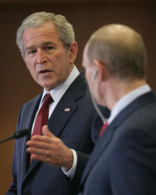 President George W. Bush looks toward President Vladimir Putin Sunday, April 6, 2008, while making remarks during a joint press availability at the State Resident of the President of Russia in Sochi. White House photo by Chris Greenberg