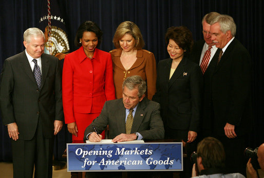 President George W. Bush signs transmittal papers for the Colombian Free Trade Agreement Monday, April 7, 2008, in Dwight D. Eisenhower Executive Office Building. President Bush is joined by, left to right, Secretary Bob Gates, Department of Defense; Secretary Condoleezza Rice, Department of State; Ambassador Susan Schwab, United States Trade Representative; Secretary Elaine Chao, Department of Labor; Director John Walters, Office of National Drug Control Policy; and Secretary Ed Schafer, Department of Agriculture. White House photo by Joyce N. Boghosian