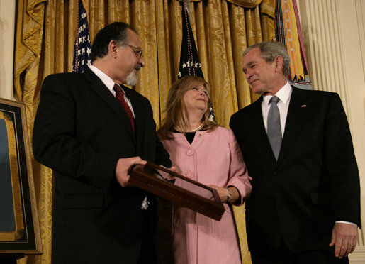 President George W. Bush smiles as he shares a moment with George and Sally Monsoor after presenting them the Congressional Medal of Honor in honor of their son, Petty Officer Michael A. Monsoor. The Navy SEAL was honored posthumously Tuesday, April 8, 2008, for his heroism while serving in Iraq. White House photo by David Bohrer