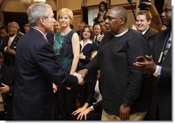 President George W. Bush reaches out to Thomas Boyd Wednesday, April 9, 2008, after signing HR 1593, the Second Chance Act of 2007. Mr. Boyd spent more than 20 years in and out of the prison system until he took his daughter's advice and enrolled in the Jericho program in Baltimore. His success in the re-entry program was noted during the President's remarks when he said, "He's working, back with his family; he's a good guy. And I want to thank you for coming, Thomas."  White House photo by Eric Draper
