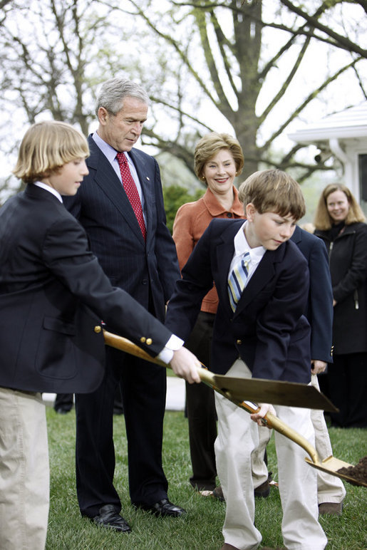 President George W. Bush and Mrs. Laura Bush watch as the young relatives of President Benjamin Harrison shovel dirt to help plant a Scarlet Oak tree Wednesday, April 9, 2008, at the commemorative tree planting on the North Lawn of the White House. The Scarlet Oak replaces a tree planted by President Benjamin Harrison that fell on October, 25, 2007. White House photo by Eric Draper