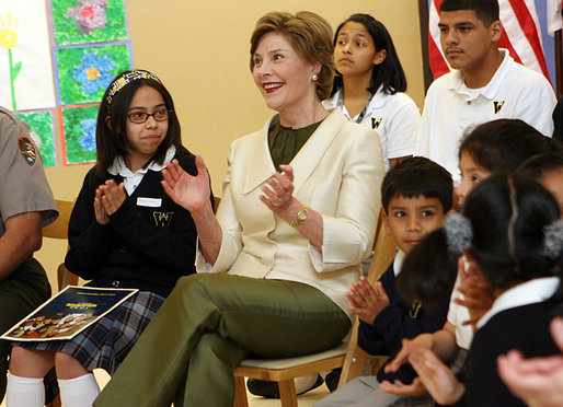 Mrs. Laura Bush applauds program speakers as she joins students from the Williams Preparatory School in Dallas, Thursday, April 10, 2008, during events at the First Bloom program to help encourage youth to get involved with conserving America's National Parks. Through the First Bloom program, the National Park Foundation and the National Park Services are joining with the Lady Bird Johnson Wildflower Center and community groups to connect young people to our national parks. White House photo by Shealah Craighead