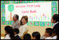 Mrs. Laura Bush sits before a banner welcoming her to the Williams Preparatory School in Dallas, Thursday, April 10, 2008, where she participated in the First Bloom program activities to help encourage youth to get involved with conserving America's National Parks. The First Bloom program is being introduced in five cities across the nation to give children a sense of pride in our natural resources and to be good stewarts of America's diverse environment. White House photo by Shealah Craighead
