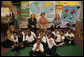 Mrs. Laura Bush, her daughter Jenna Bush, left, and U.S. Education Secretary Margaret Spellings pose for a photo with the first grade students of teacher Laura Gilbertson, right, Monday, April 14, 2008, at the Martin Luther King Elementary School in Washington, D.C., to mark the tenth anniversary of Teach for America Week. White House photo by Shealah Craighead