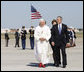 President George W. Bush, Mrs. Laura Bush and daughter, Jenna Bush, walk with Pope Benedict XVI after the Pontiff's arrival Tuesday, April 15, 2008, at Andrews Air Force Base, Maryland. White House photo by Eric Draper