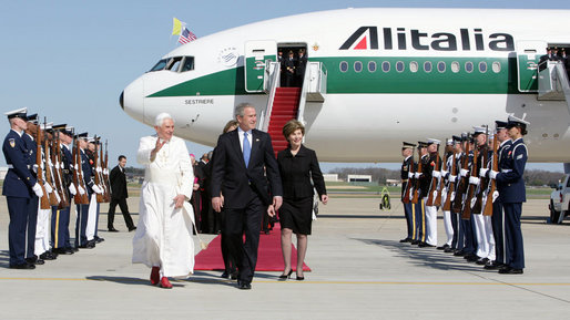 President George W. Bush walks the red carpet with Pope Benedict XVI upon the Pontiff's arrival Tuesday, April 15, 2008, at Andrews Air Force Base, Maryland. Mrs. Laura Bush and daughter Jenna also were on hand to accompany welcome the Pope. White House photo by Chris Greenberg