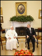 President George W. Bush and Pope Benedict XVI meet in the Oval Office Wednesday, April 16, 2008, following the Pope's welcoming ceremony on the South Lawn of the White House. White House photo by Eric Draper