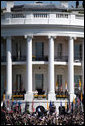 President George W. Bush and Mrs. Laura Bush stand with Pope Benedict XVI as he acknowledges the cheers from the crowd from the South Portico balcony Wednesday, April 16, 2008, on the South Lawn of the White House. White House photo by Grant Miller