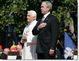 President George W. Bush and Pope Benedict XVI stand together during the playing of the National Anthem at the Pope’s welcoming ceremony on the South Lawn of the White House Wednesday, April 16, 2008. White House photo by Shealah Craighead