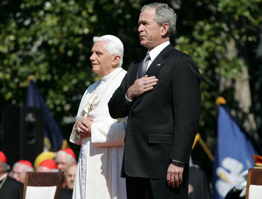 President George W. Bush and Pope Benedict XVI stand together during the playing of the National Anthem at the Pope’s welcoming ceremony on the South Lawn of the White House Wednesday, April 16, 2008. White House photo by Shealah Craighead