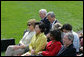 Mrs. Laura Bush joined by Mrs. Kim Yoon-ok, wife of the South Korean President Lee Myung-bak, U.S. Secretary of State Condoleezza Rice, and U.S. Defense Secretary Robert Gates listen during a joint press availability with President George W. Bush and South Korean President Lee Myung-bak Saturday, April 19, 2008, at the Presidential retreat at Camp David, Md. White House photo by Joyce N. Boghosian