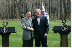 President George W. Bush shakes hands with South Korean President Lee Myung-bak at the conclusion of a joint press availability Saturday, April 19, 2008, at the Presidential retreat at Camp David, Md. White House photo by Shealah Craighead